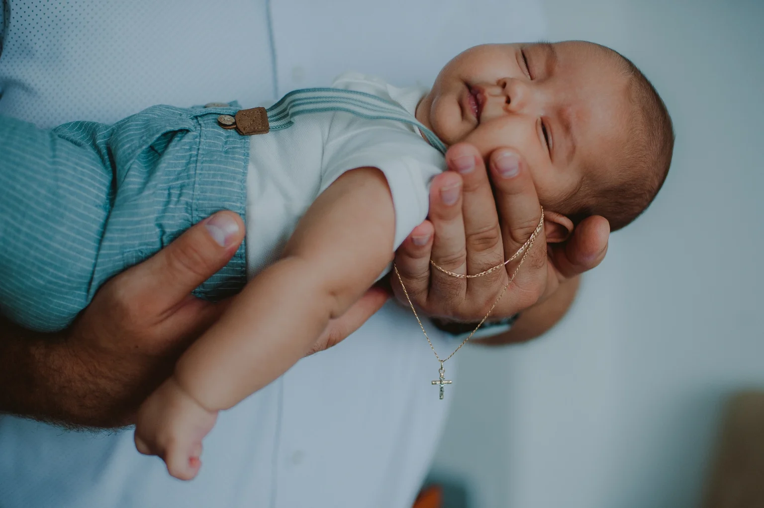 Portrait of a baby during their baptism in Vienna, capturing cherished memories. The image highlights the baby’s serene expression and the significance of the baptism ceremony.