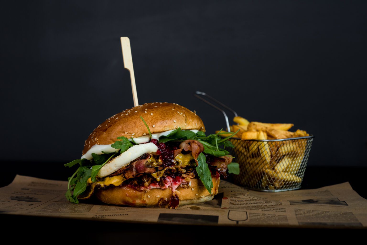 Gourmet burger topped with fresh ingredients during a professional food photography session in Vienna