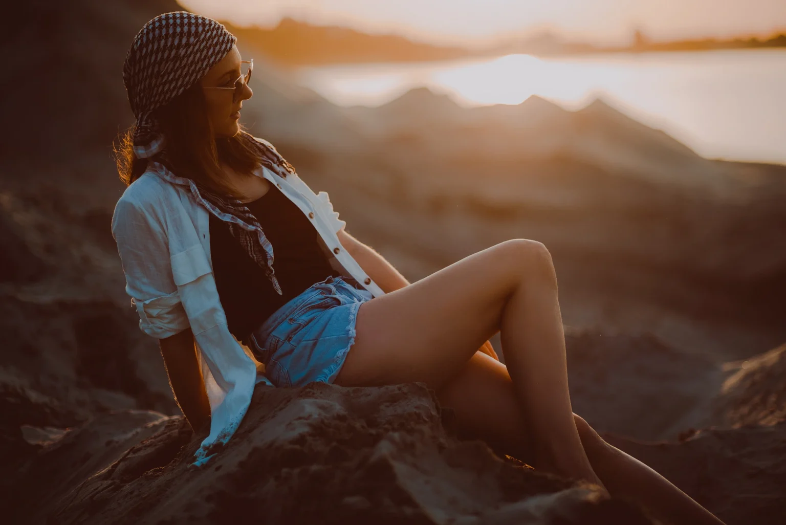Professional female business portrait at Donau sand beach in Vienna. The image captures the businesswoman's confidence and professionalism with a natural beach setting along the Danube River
