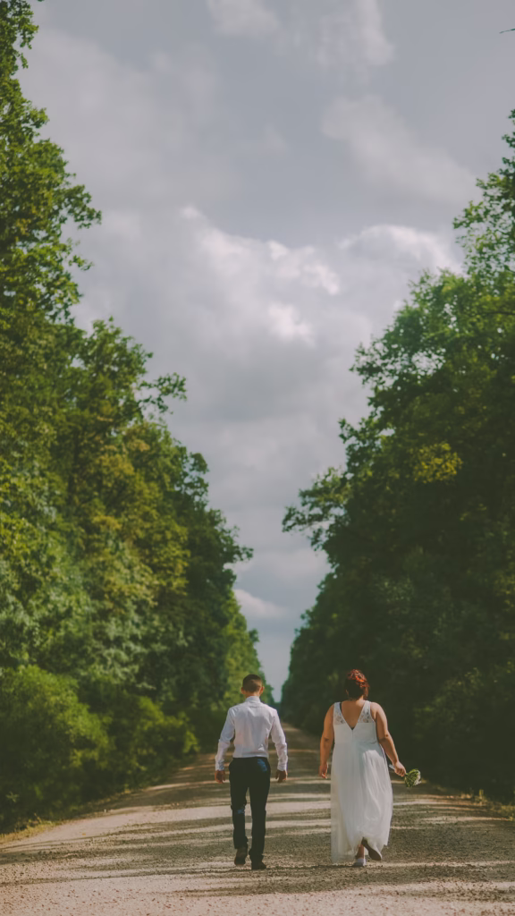 Happy newlyweds celebrating their Vienna wedding, embracing and laughing as they walk hand in hand.