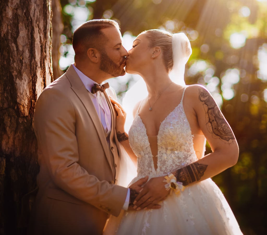 Bride and groom sharing a romantic moment at Schönbrunn Palace in Vienna during golden hour.